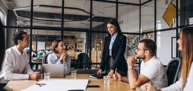 Group of people working out business plan in an office